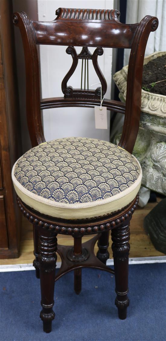 A revolving music stool, H.85cm